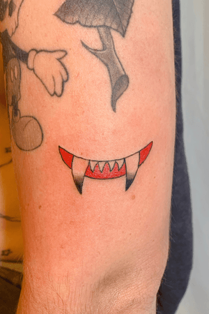 Evil Smile - Minimal illustration tattoo 