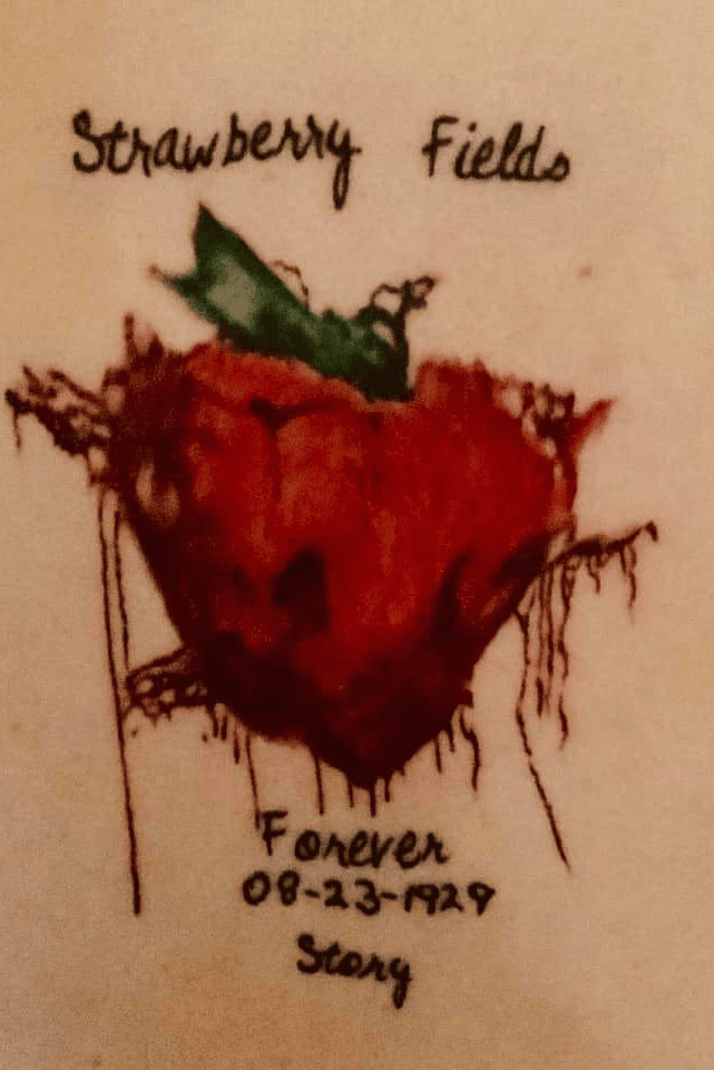 Strawberry Fields lettering tattoo in red ink