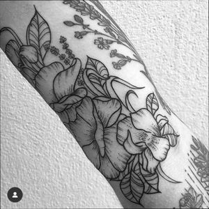 Irises, poppies, lavender and sweetpea by Gee Hawkes (@geehawkestattoo on Instagram) at Death's Door. 
