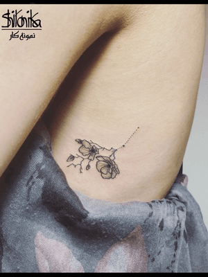 Orchid tattoo with Aries constellation