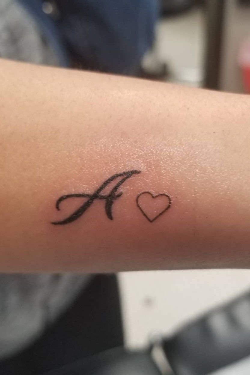 Designs by rachelxx4  heart shape tattoo with letters