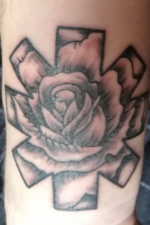 Red hot chili peppers logo with rose 🤘
