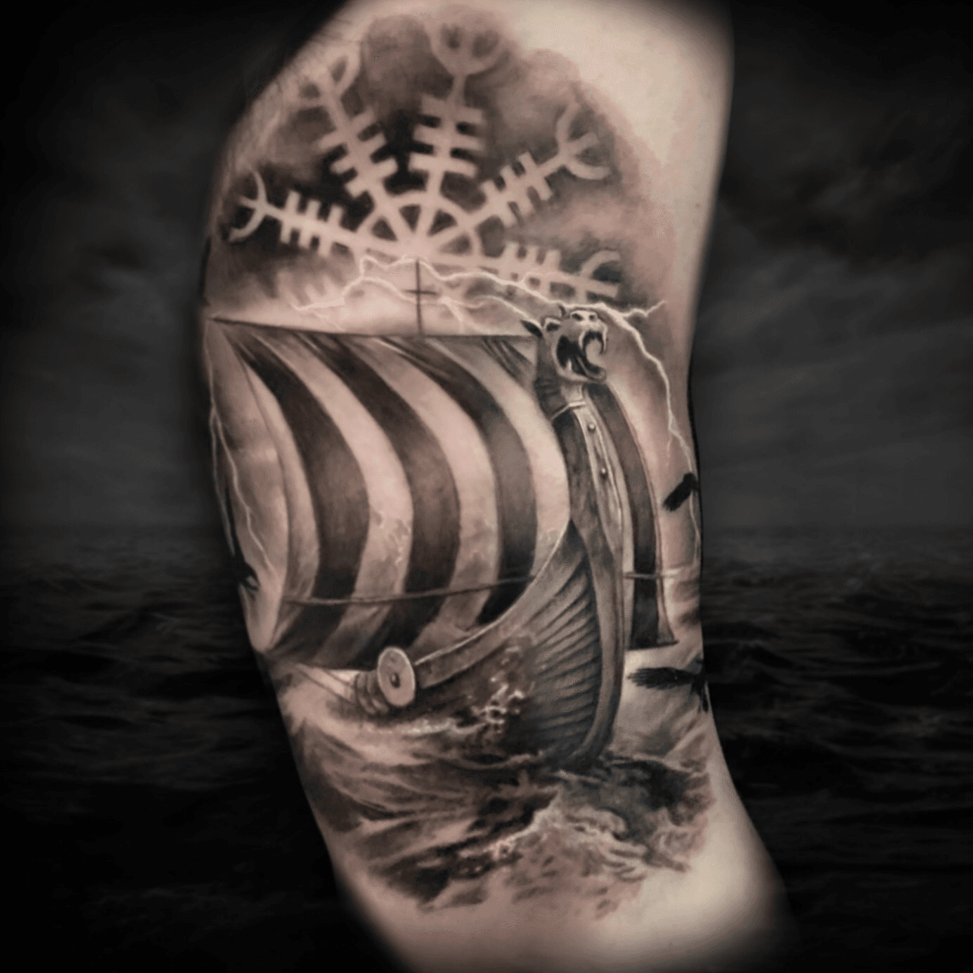 Viking ship tattoo on the inner arm