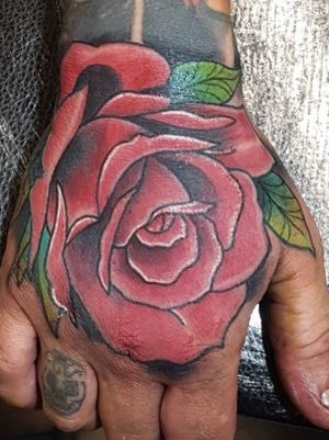 Traditional rose on a hand
