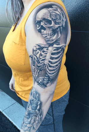 Client photo of a sleeve-in-progress. Upper arm fresh after one 11-12 hour session; forearm healed after one 8 hour session. 