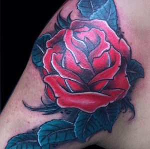 Rose tattoo on shoulder. 