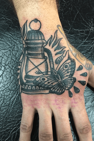 Lantern and moth on the hand 