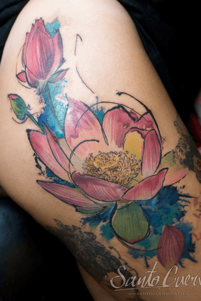 Beautiful watercolor lotus flower tattoo on the upper leg, done by the talented artist Alex Santo