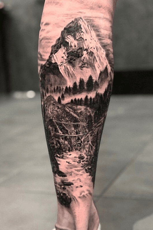 Mountains and trees tattoo on thigh  Tattoogridnet
