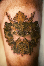 Green man face on thigh 