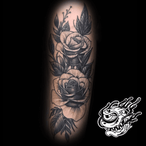 Pepper shaded Roses on the forearm.