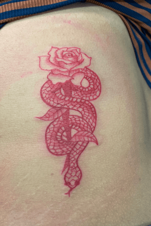 Red ink rose and snake tattoo