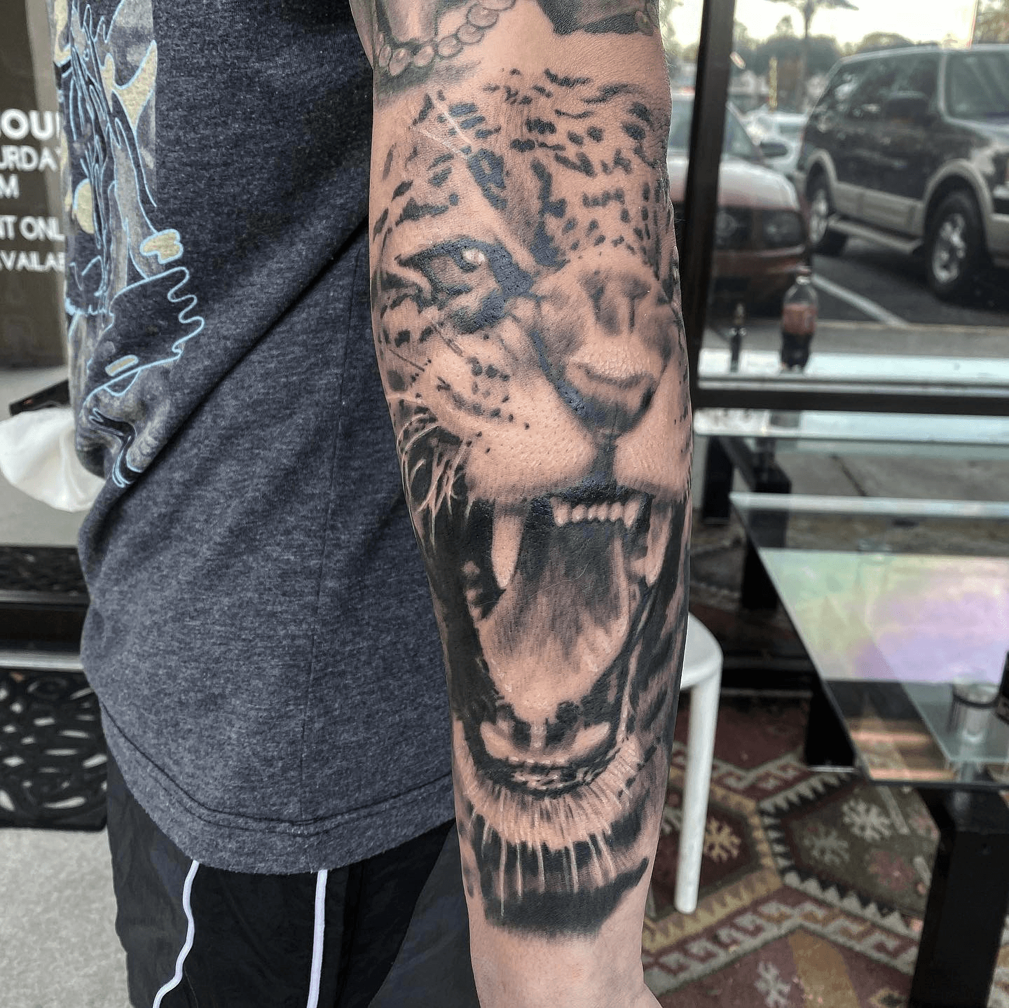 Jaguar and Hibiscus Lower Arm Tattoo  Remington Tattoo Parlor
