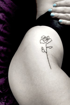 My favourite tattoo, a continuous one line rose. I like fine black line tattoos.
