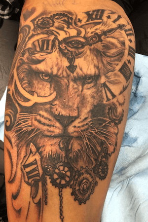 Black and grey tattoo on upper thigh 