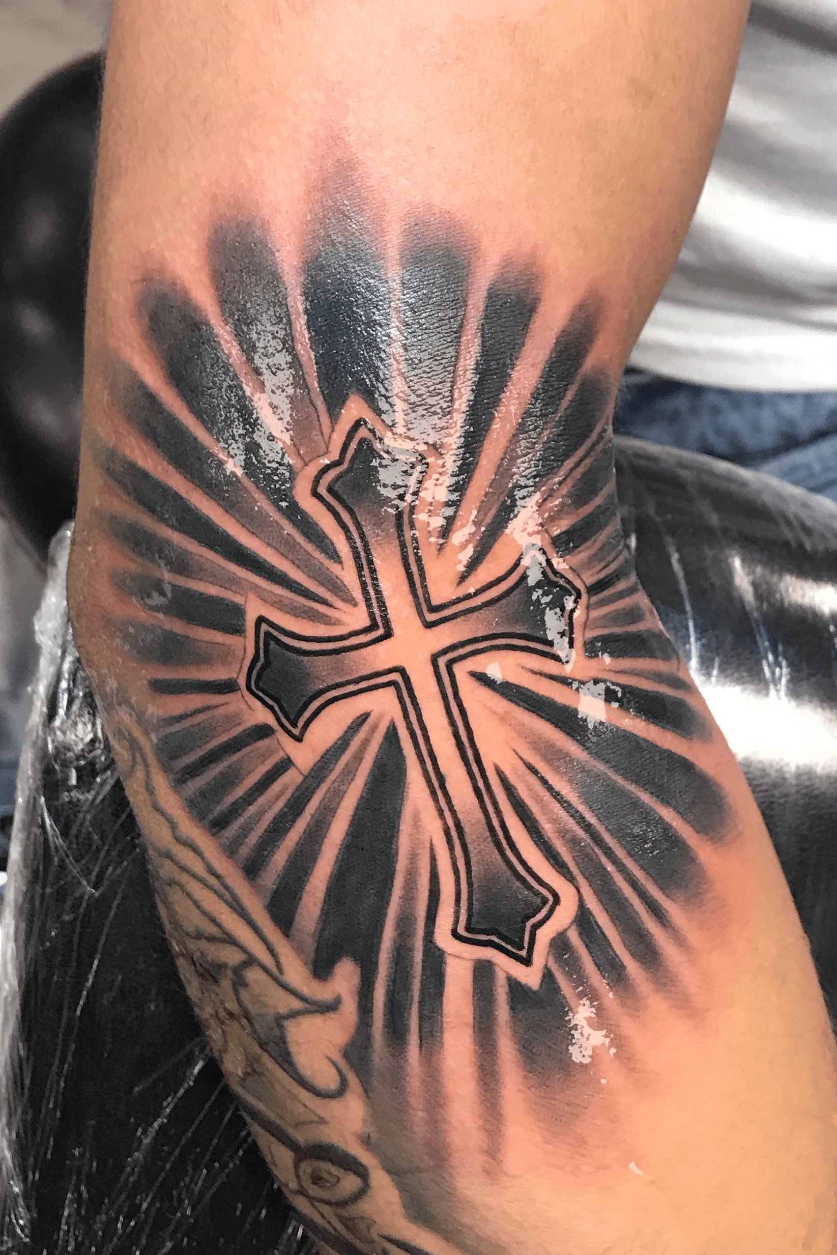 Black Rose With Light Rays Tattoo On Arm