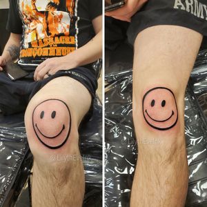This one made me giggle a lot! Smiley face tattoo on the kneecap.