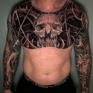Scary animal skull tattoo on full chest, London | #blackandgreytattoos #realistictattoos #chesttattoos #skulltattoos