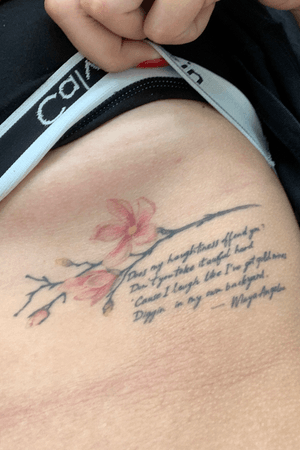 My second tattoo. A cherry blossom with a Maya Angelou quote.