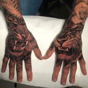 Lion and tiger hand tattoos, London, UK | #blackandgrey #realistic #handtattoos #liontattoo #tigertattoo