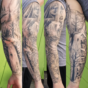 Beautiful sleeve done on me by Chad Green @ Artistic Minds in Carbondale IL #nature #sleeve #tiger #bear #waterfall #tree #blackandgrey 