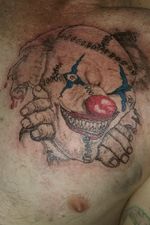 Clown breaking through skin