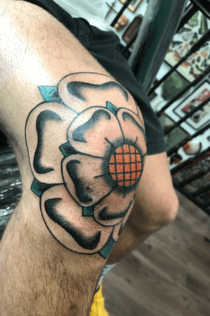 Yorkshire rose tattoo on knee by Chris Lambert. Tattooed at Snake and Tiger Tattoo in Leeds city centre. To make a booking please see details on my website www.chrislamberttattoo.com