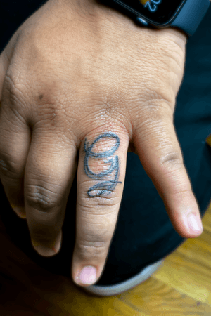 Letter G finger tattoo