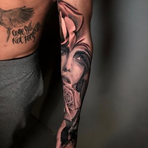 Woman portrait and roses sleeve tattoo in progress, London, UK | #blackandgreytattoos #realistic #fullsleevetattoos #portraittattoos #rosetattoo
