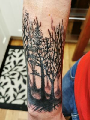 Dark trees / dark forest.My 10th tattoo, session one by Julie Manson. 14th December 2019.