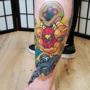 This is one of the best tattoos I've ever gotten, its samus and dark samus with a bunch of metroids surrounding#Metroid #Nintendo #Samus