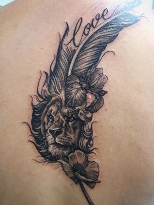 Lion feather tattoo