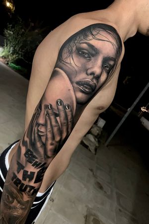 Behind the mask theme tattoo woman portrait holding mask. Black and grey done at : Eel ink Porto heli
