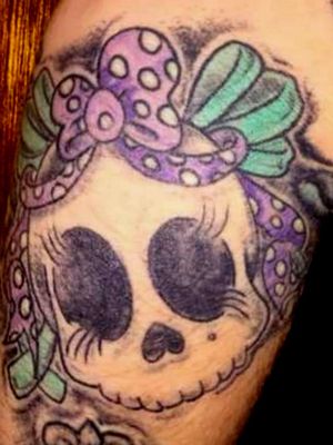 Girly skull added to right arm