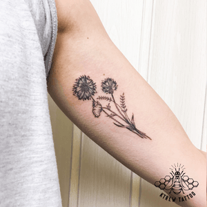 Cornflower & Poppy Sprig Tattoo by Kirstie Trew @ KTREW Tattoo • Birmingham, UK 🇬🇧 #cornflowertattoo #poppytattoo #delicatettattoo #blackworktattoo #armtattoo #sprigtattoo 