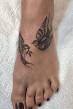 Swallows on the topf of foot