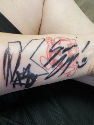 Signatures of WWE Superstars, Kevin Owens and Sami Zayn over logos. Both logo and signatures done by the amazing;; https://instagram.com/bodyartstudio13tattoos?igshid=1gddrli2c9q Check him out. Tony is an absolute sweetheart and is so easy to talk to. He even puts things to watch on while he works on you.