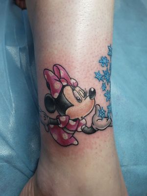 Small, Full Color Disney tattoo on right ankle.