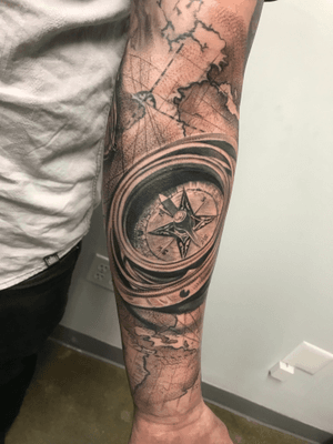 Experience the artistry of Jake Masri with this black and gray compass tattoo on your forearm. Navigate through life with style and precision.