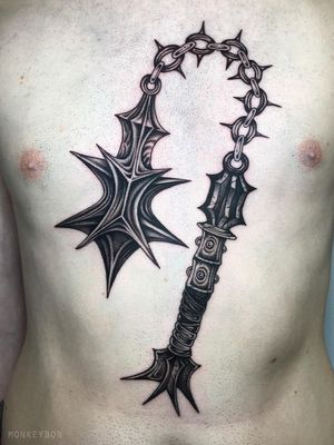 Weapon tattoo.