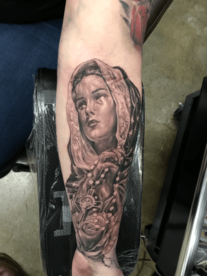 Experience the power of faith with this stunning black and gray, neo-traditional tattoo featuring Jesus and Maria. Expertly crafted by Jake Masri.