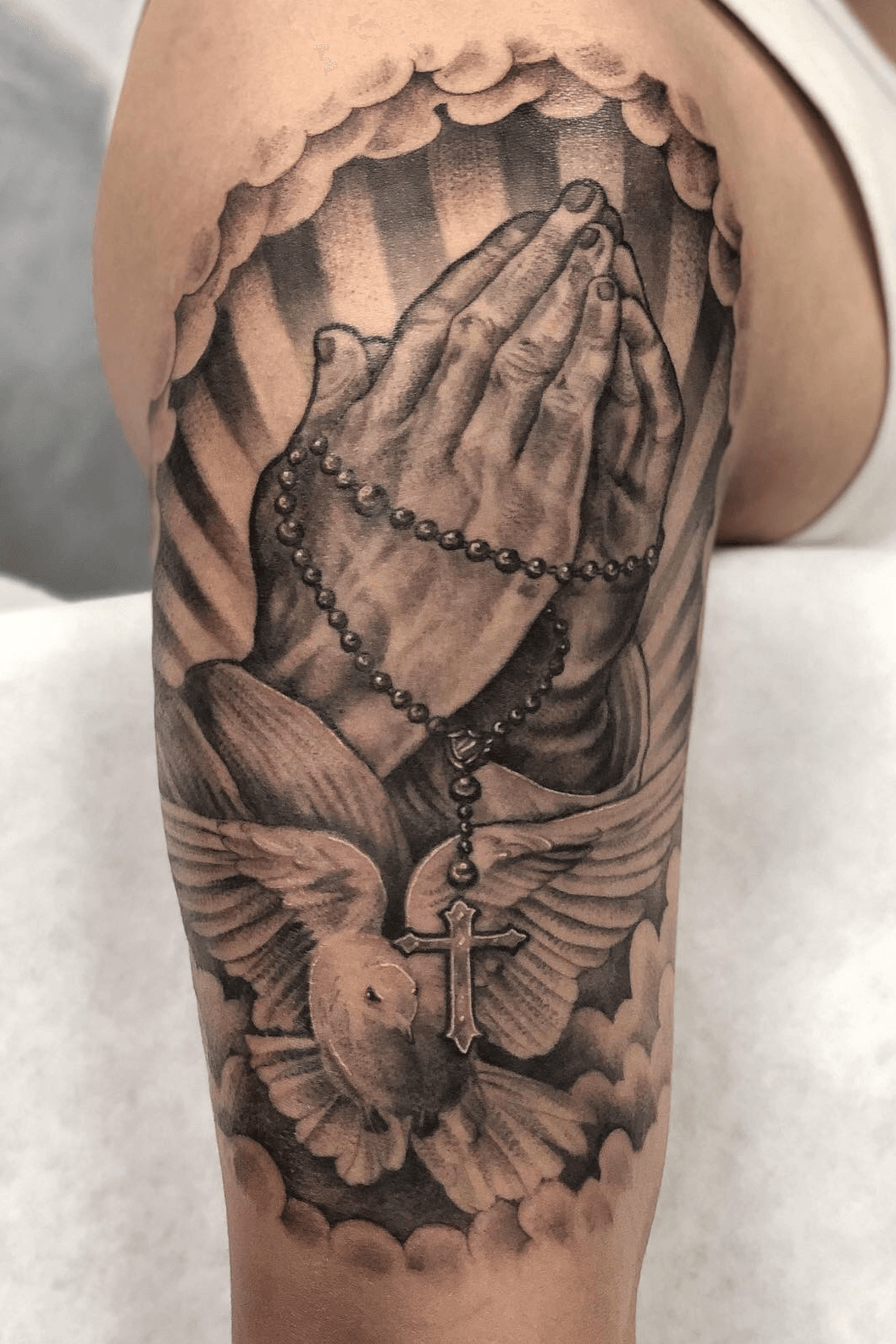 Tattoo uploaded by Justin JP Param  Mostly healed just finished the  background and som spots Always praying for better days Booking for 2020  now blackand grey prayinghandstattoo rosary dovetattoo sleevetattoo  peaces 