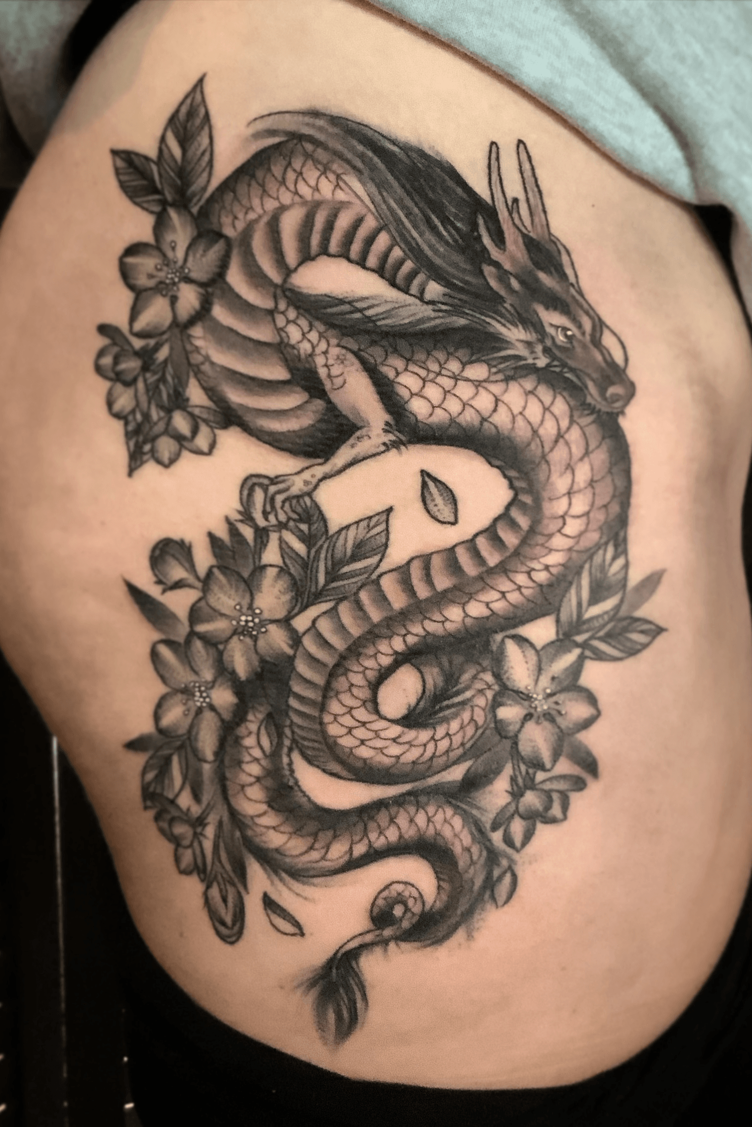 Dragon with blue and coral peonies thigh tattoo for Ashlyn  Did 2  sessions on this piece parts healed and fresh  Instagram