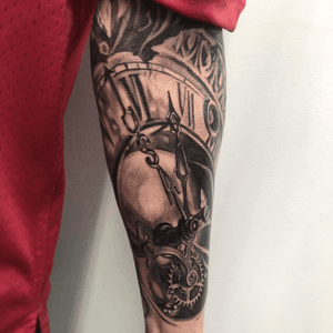 Unique blackwork forearm tattoo of a detailed watch design by tattoo artist Jake Masri.