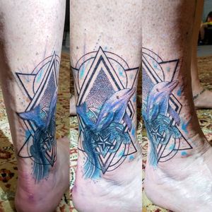 Geometric watercolor dolphin which is a cover up/we work of an old star & wave