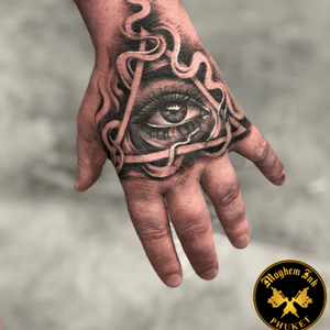Realistic Tattoo: Tattoo Of An Eye On Hand At Mayhem Ink Phuket, we promise you that you’ll have the best realistic tattoo artists who are fully capable and adaptable to your needs. For more info call us at +669-3763-8542 or visit us at https://mayheminkphuket.com/realistic-tattoo-artists/ 