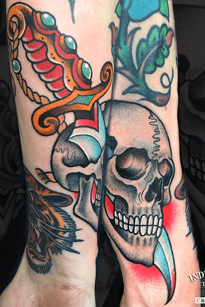 Traditional Old school skull and dagger tattoo by Craig Kelly