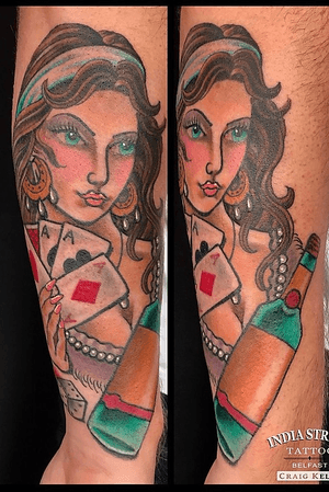 Traditional man’s ruin girlhead tattoo by Craig Kelly