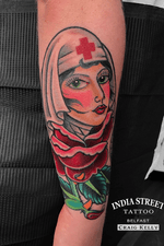 Traditional old school rose of no mans land girlhead tattoo by Craig Kelly