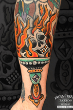 Traditional old school skull torch tattoo by Craig Kelly
